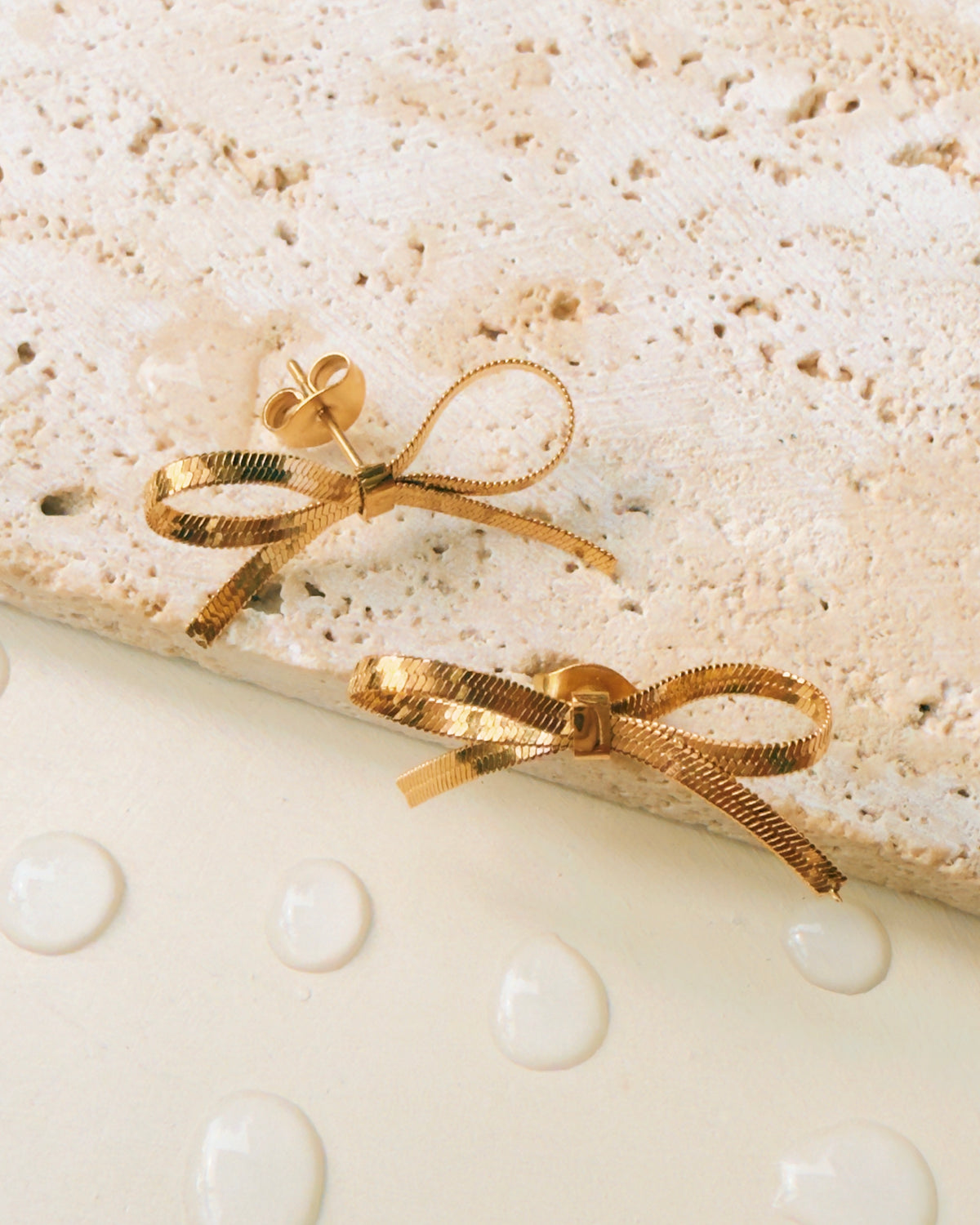 Nikita Bow Ribbon Shaped Flat Snake Chain Hollow Design Gold Stud Earrings