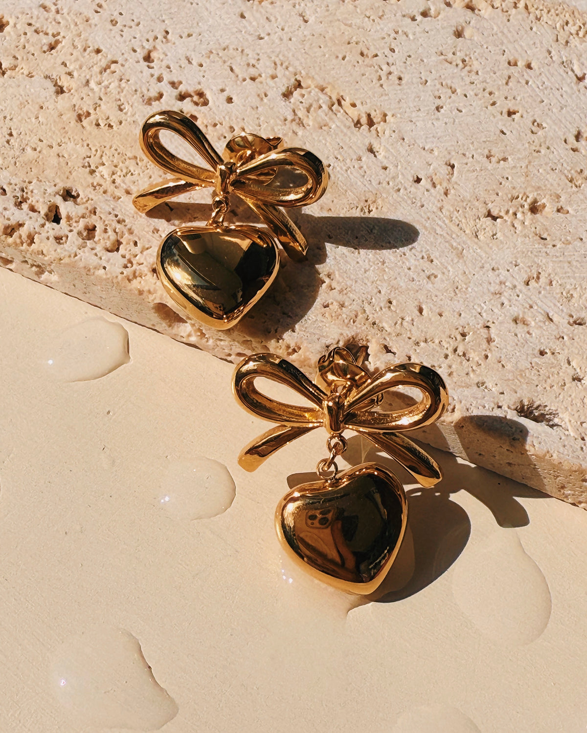 Miller (Gold) Bow Ribbon Shaped Stud Solid Heart Shaped Gold Drop Earrings