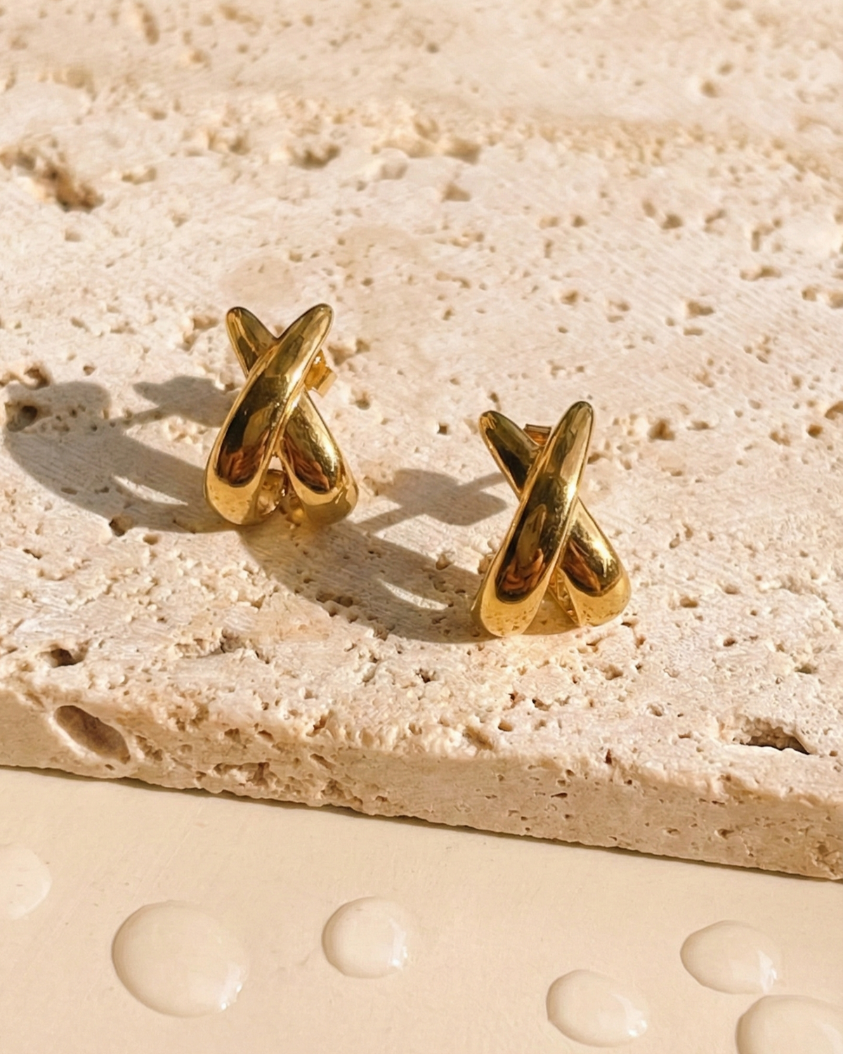 Idra Intercrossed Flat C Shaped Huggies Gold Stud Earrings