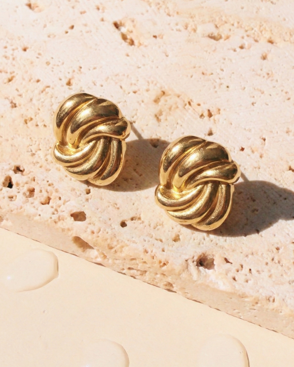 Rethira Oval Shaped Swirl Design Gold Studs