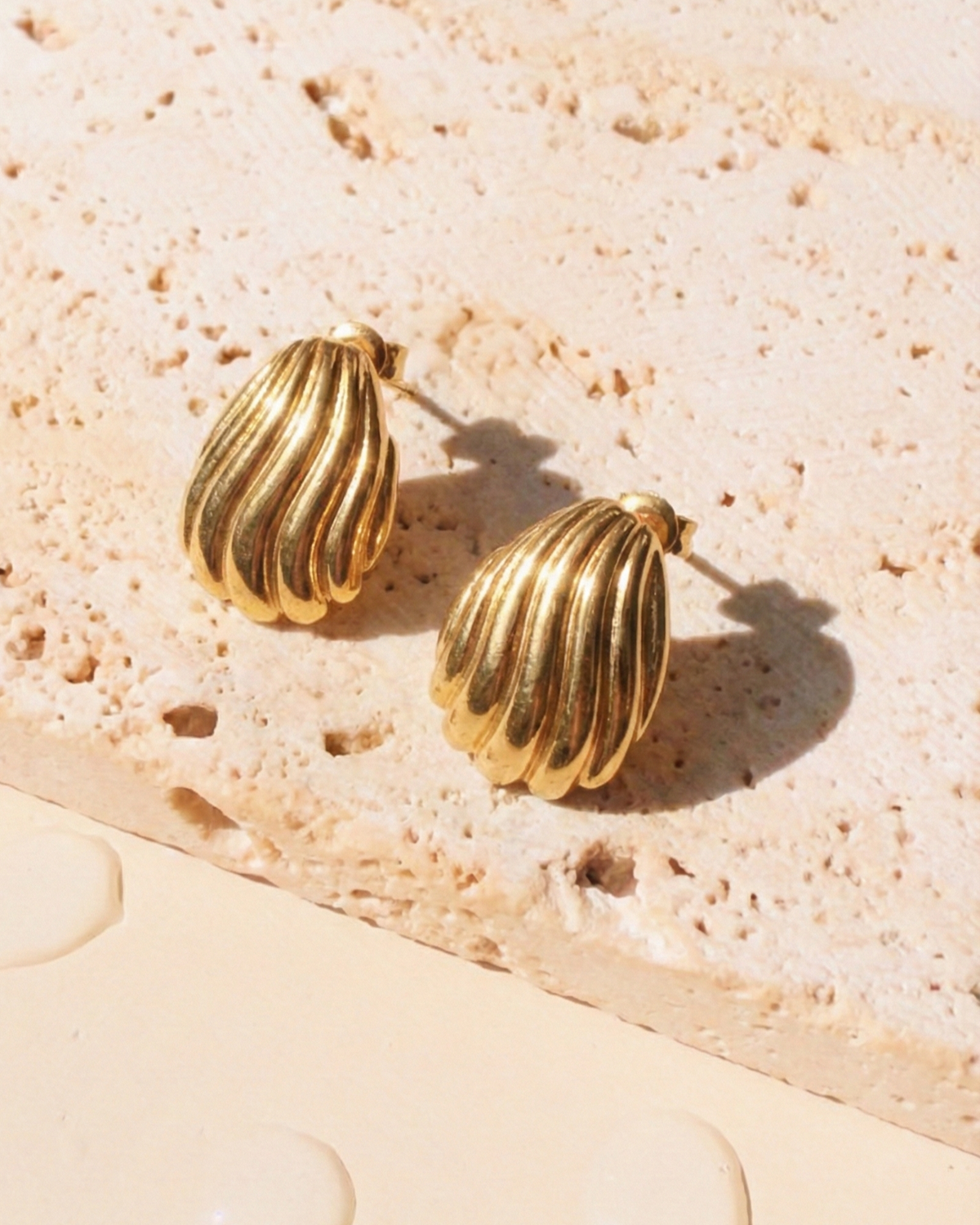 Rilavyn Egg Shaped Wavy Stripe Design Gold Studs