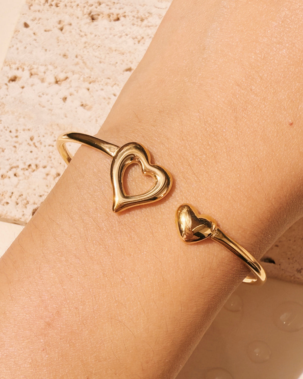 Justine Dual Tip Hollow Melted Heart Solid Heart Flat Design Gold Bangle