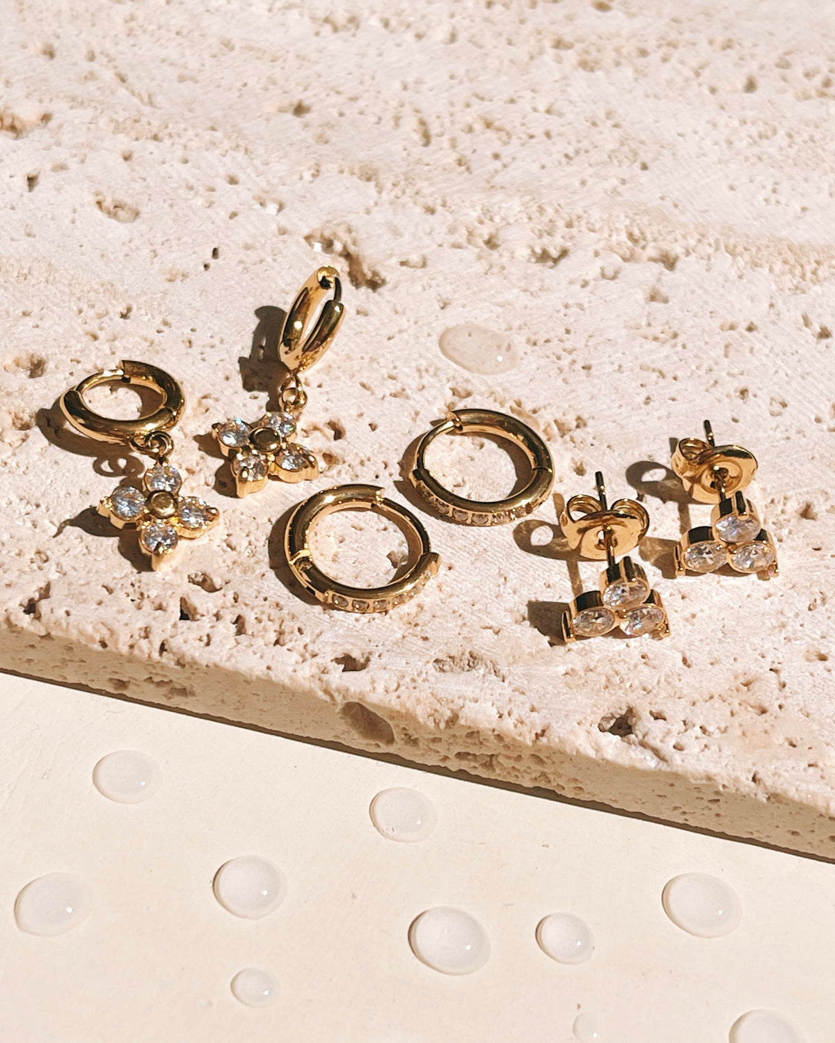 Charisse (Bundle Set) 3 Pairs Zircon Bezel Set Star Design Dangle Gold Huggies Zircon Paved Round Gold Huggies Zircon Bezel Set Flower Design Studs