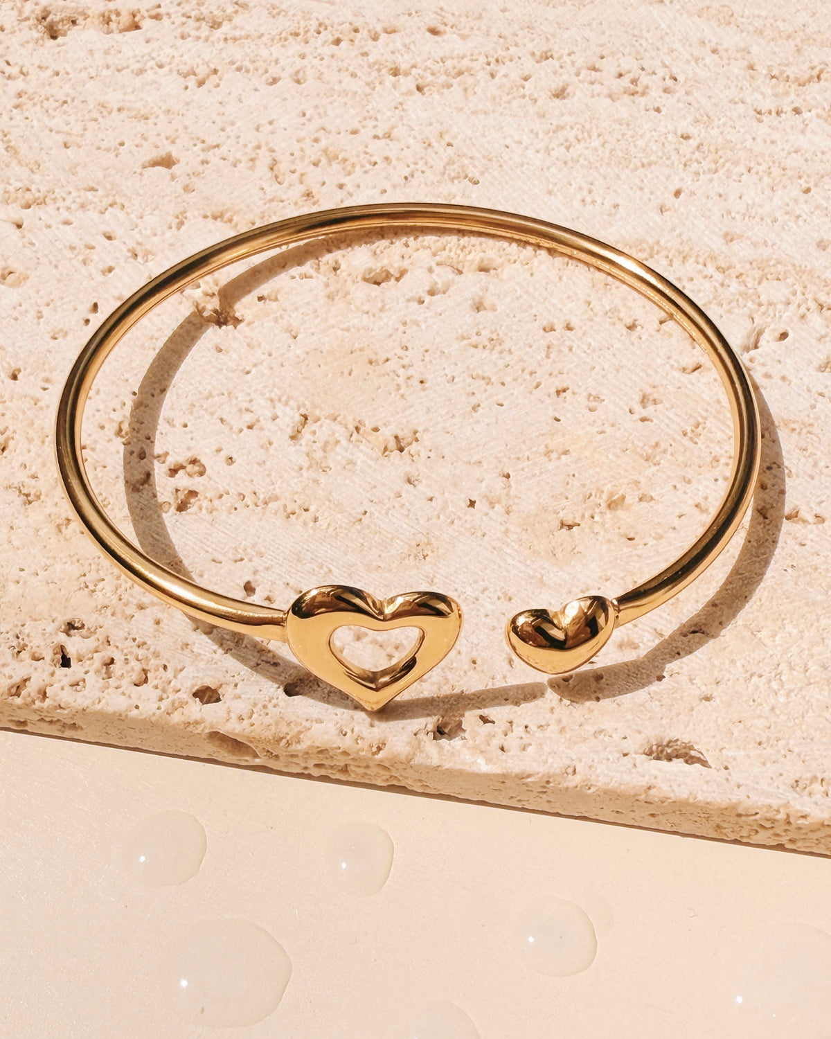 Justine Dual Tip Hollow Melted Heart Solid Heart Flat Design Gold Bangle