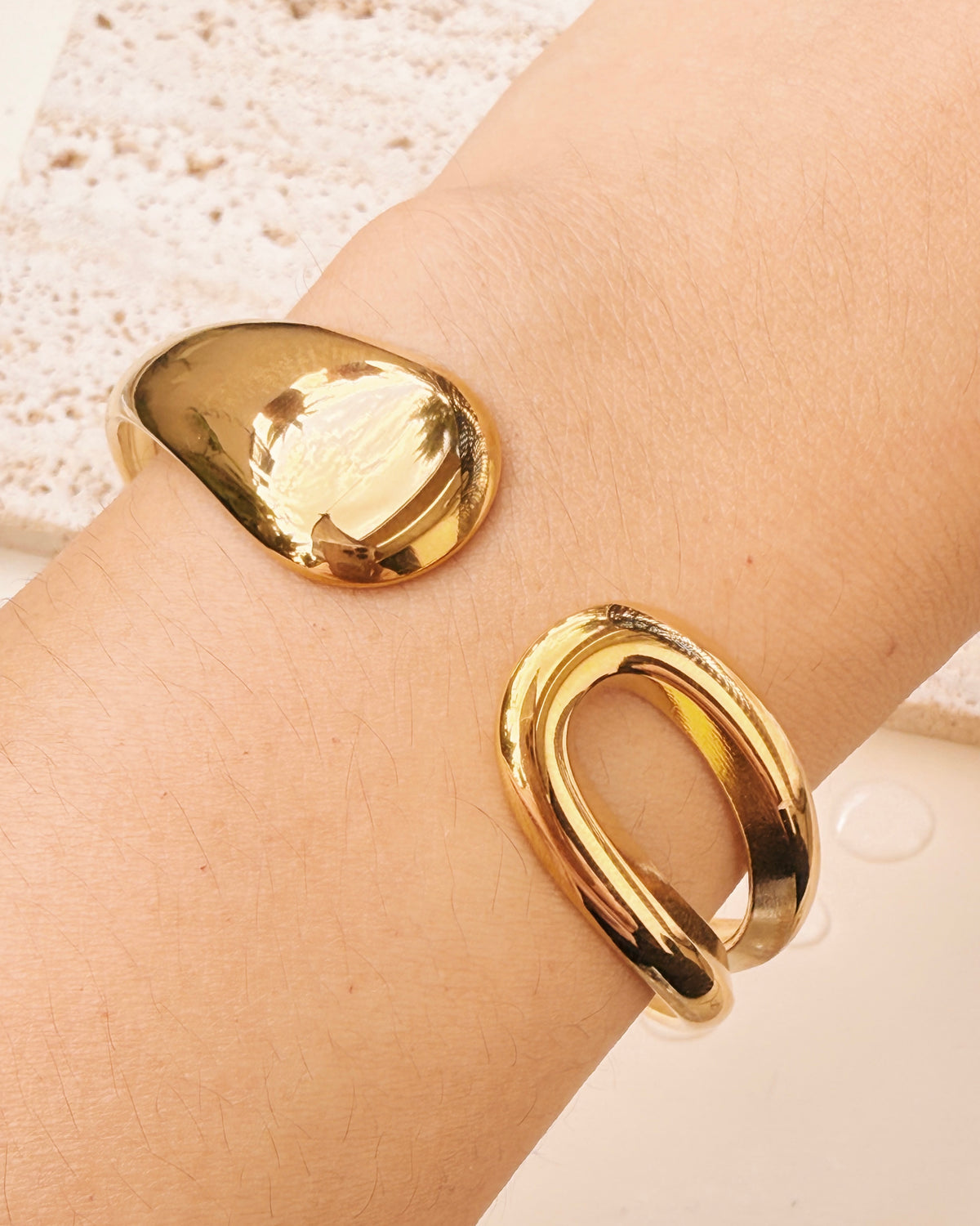 Kenna Flat Water Drop Wide Hollow Center Design Gold Bangle