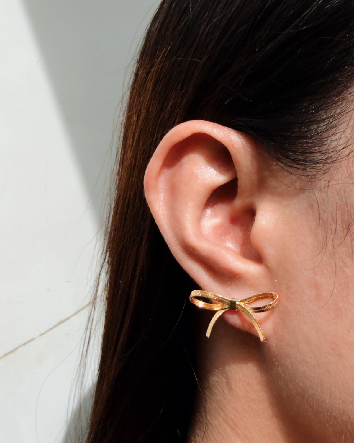 Nikita Bow Ribbon Shaped Flat Snake Chain Hollow Design Gold Stud Earrings