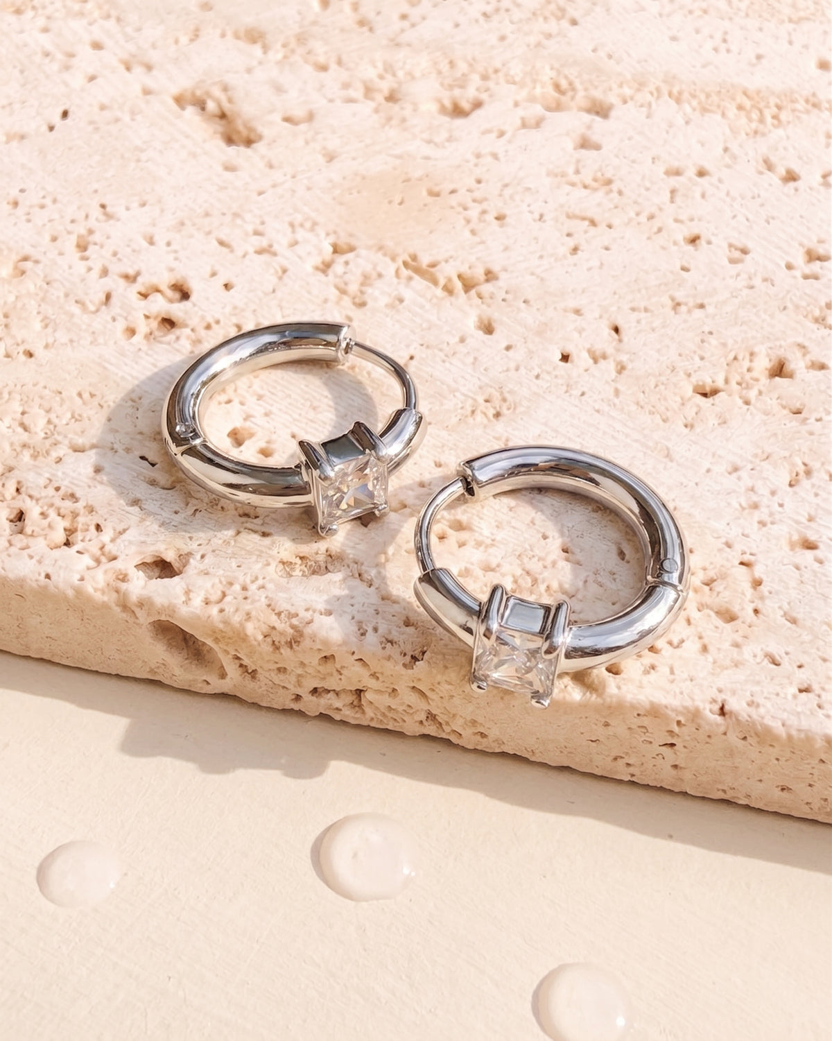 Darcelle (Silver) Classic Round Huggies Square Shaped Zircon Crowned Set Inlaid Middle Design Silver Huggies