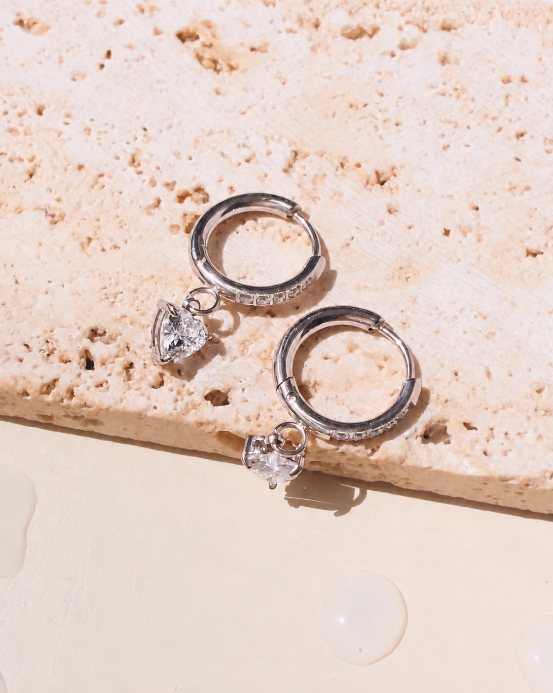 Luz (Silver) Zircon Paved Rounded Huggies Heart Shaped Zircon Crowned Set Silver Drop Earrings