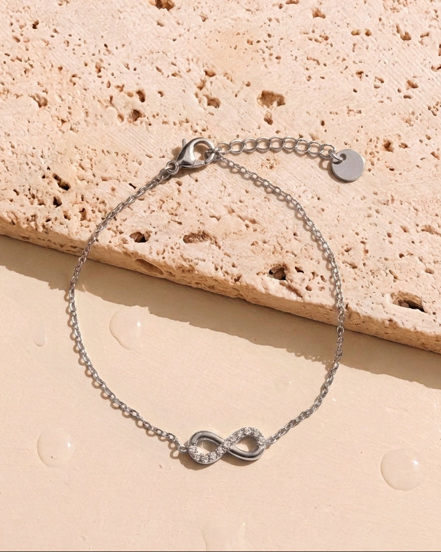 Solana (Silver) Zircon Paved Half Side Hollow Infinity Shaped Pendant Classic Thin Link Chain Silver Bracelet