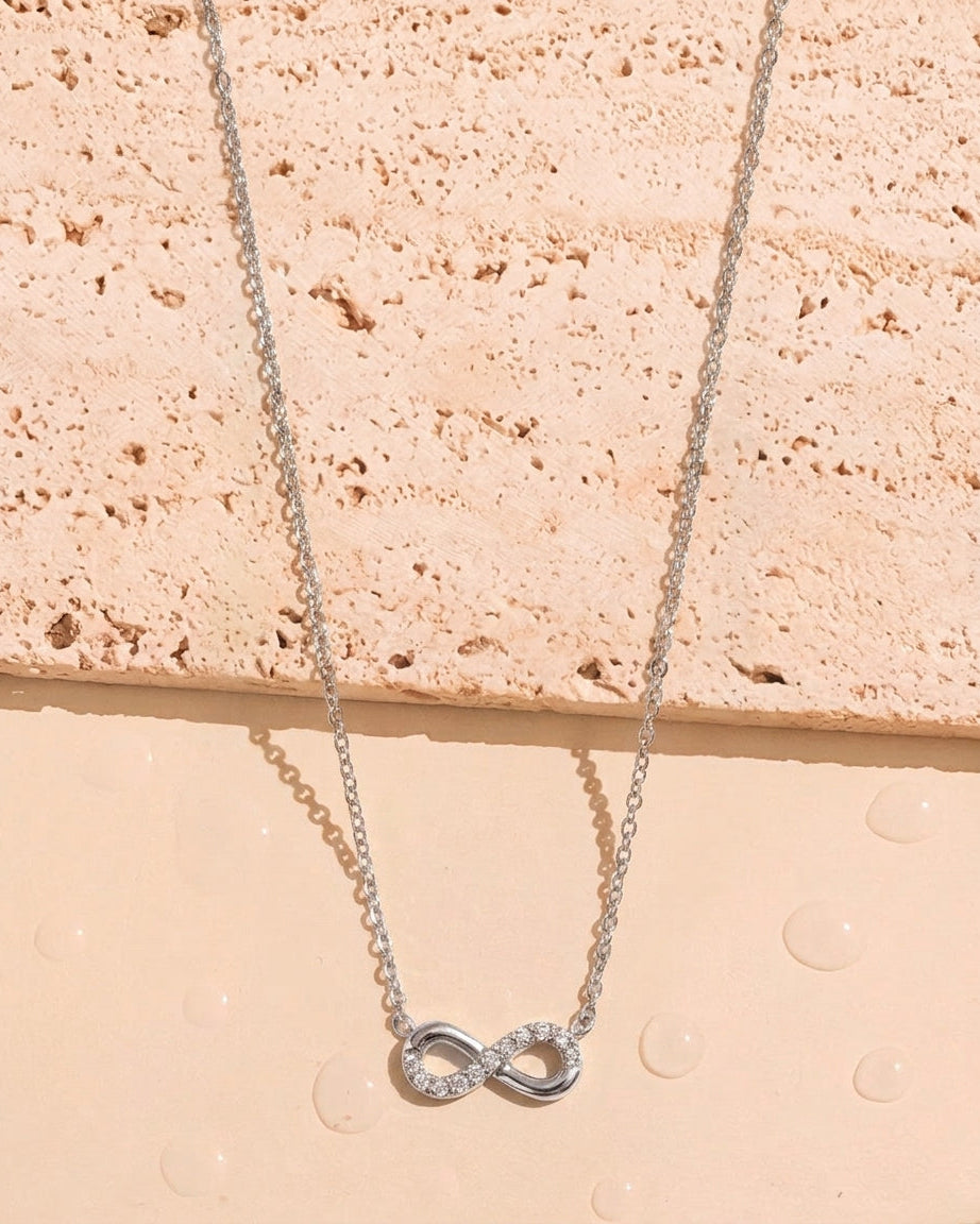 Somerset (Silver) Zircon Paved Half Side Hollow Infinity Shaped Pendant Classic Thin Link Chain Silver Necklace